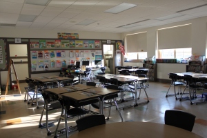 Empty desks in classroom and ceiling